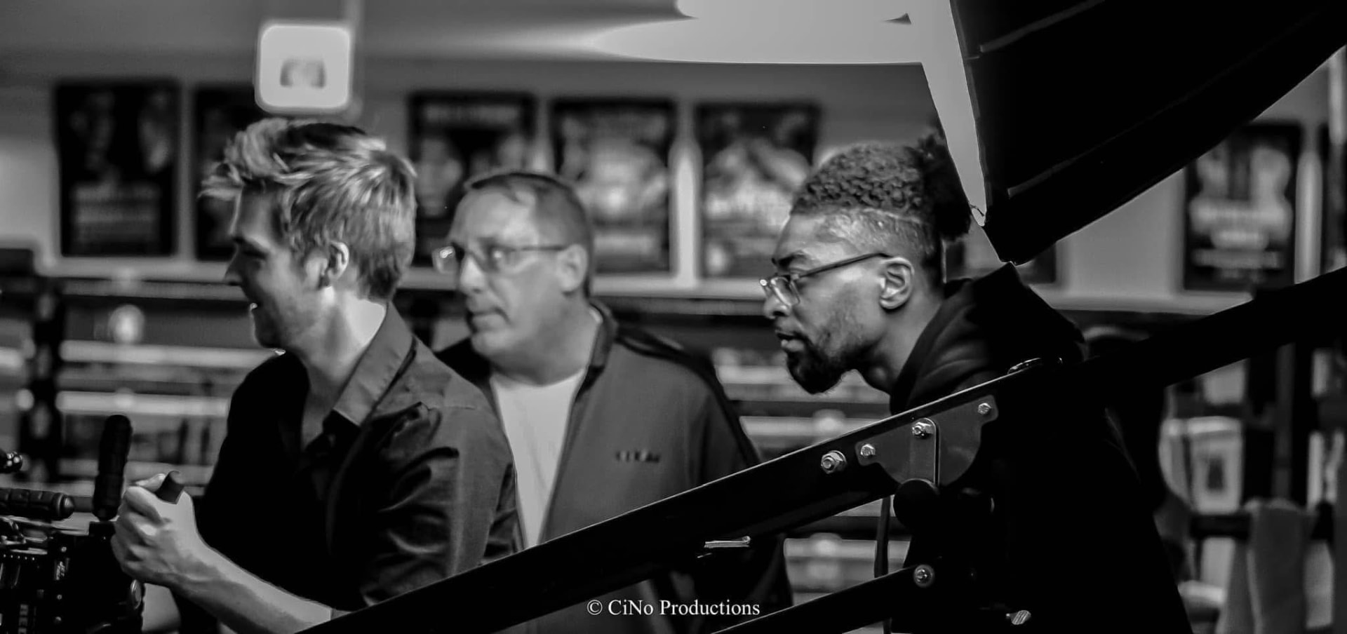 Crew reviewing a take behind the monitor