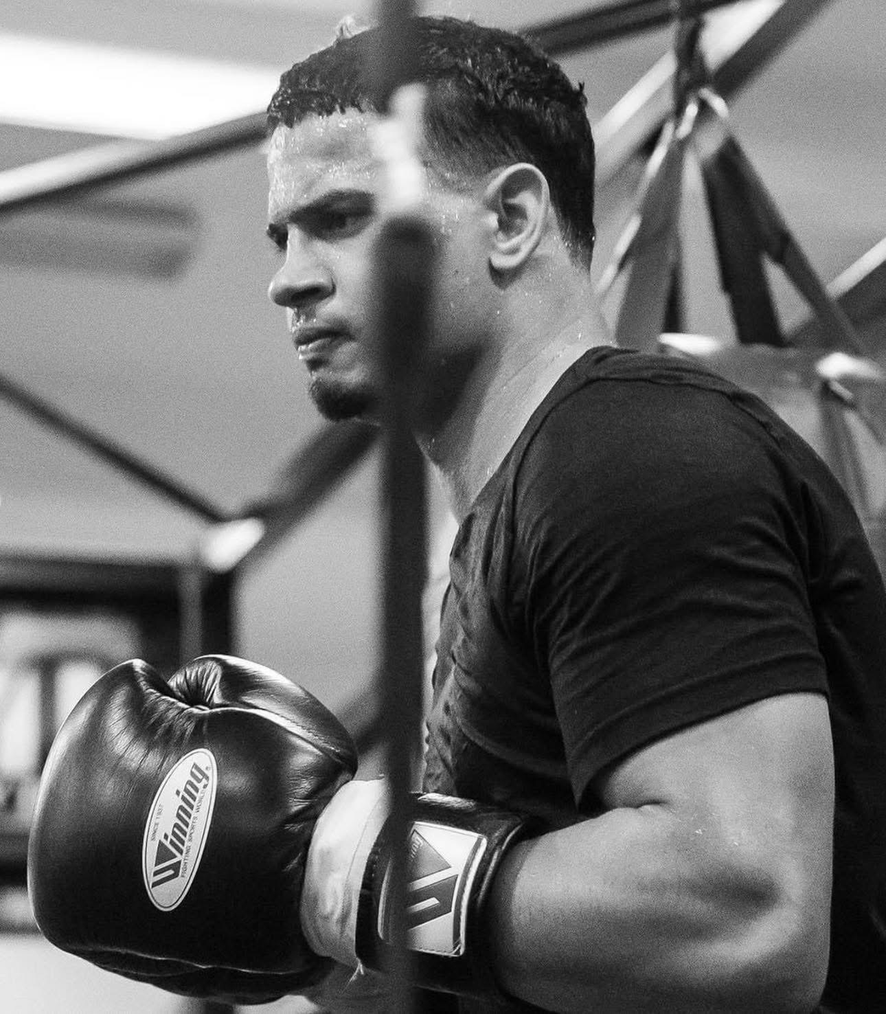 Black and white portrait of a boxer resting between rounds