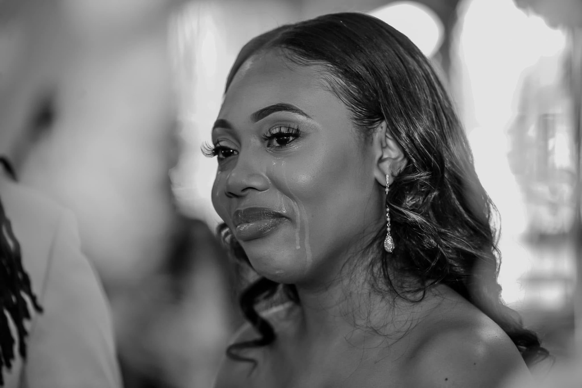 Bride in tears during the vows, shot in black and white