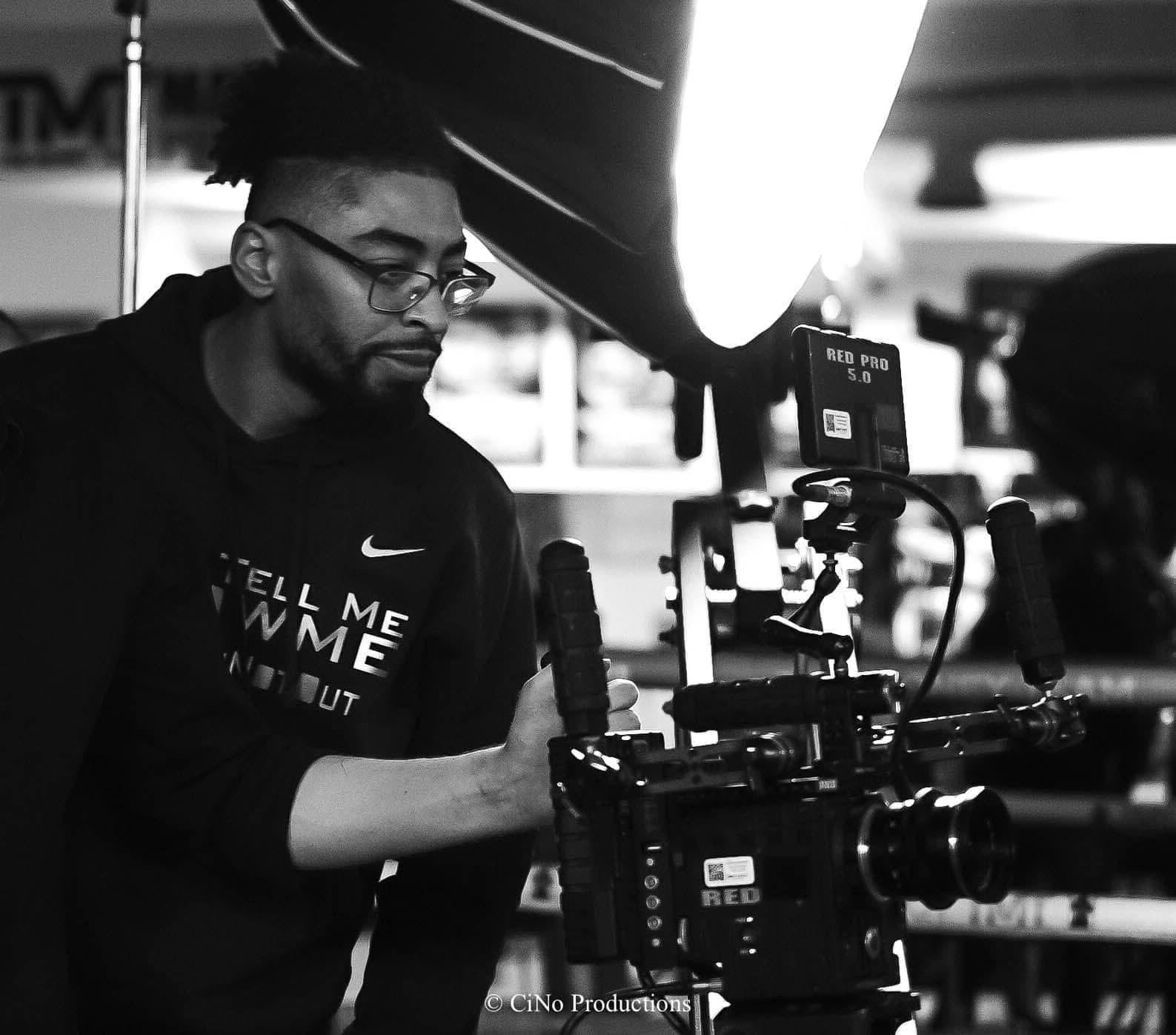Tarrell DeLoach on set with a RED cinema camera