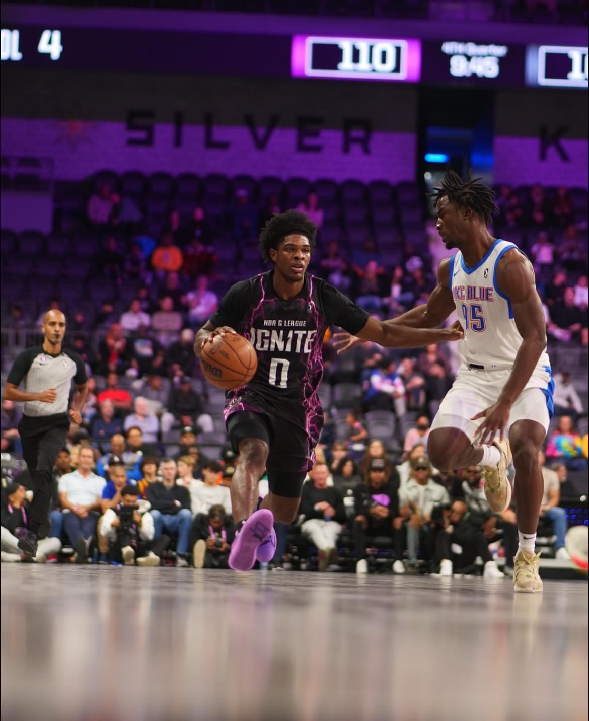 G League guard driving the lane against a defender