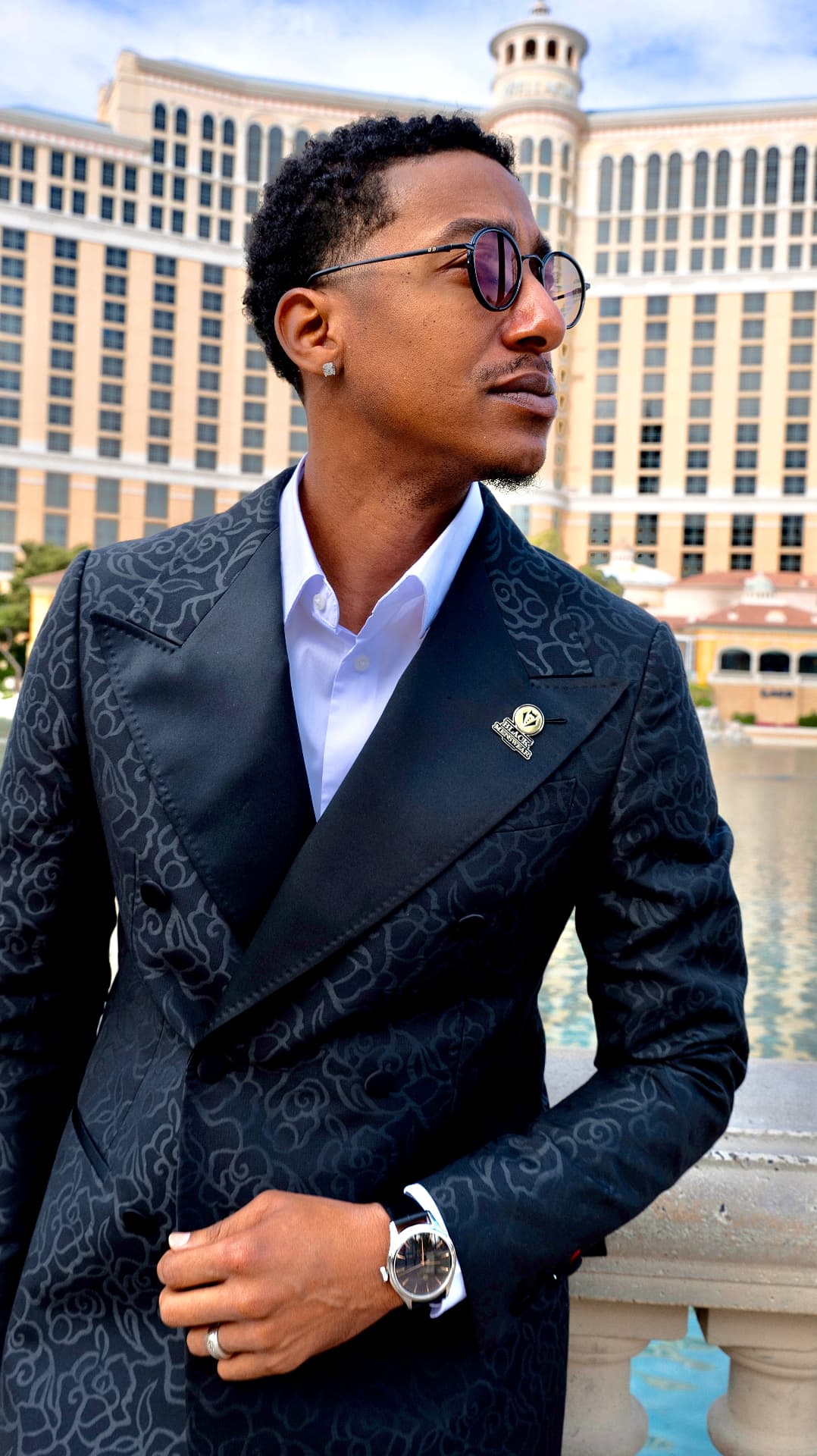 Editorial portrait of a man in a black patterned suit in Las Vegas