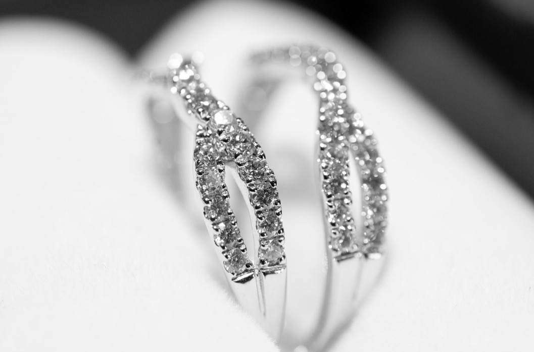 Black and white macro detail of a diamond wedding band set